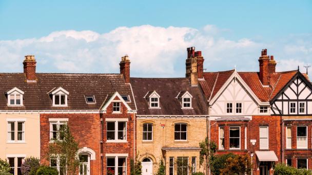 A shot of old brick houses in a row on a sunny day in England